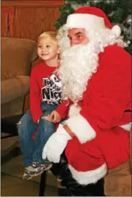  ?? MARTHA GEHRINGER — FOR DIGITAL FIRST MEDIA ?? Zachary Paskel tells Santa what he wants for Christmas.