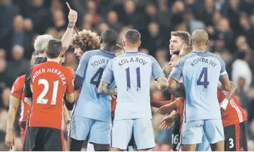  ??  ?? Fellaini is shown a red card by referee Martin Atkinson during the English Premier League match between Manchester City and Manchester United at the Etihad Stadium in Manchester, north west England. — Reuters photo