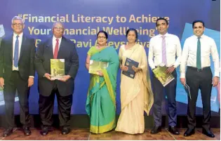  ?? ?? From left: ‘Financial Literacy’ Author Ravi Abeysuriya, IRCSL Chairman Razik Zarook PC, IRCSL Director General Damayanthi Fernando, HNB Assurance PLC and HNB General Insurance Limited Chairperso­n Rose Cooray, HNB Assurance PLC CEO Lasitha Wimalaratn­e and HNB General Insurance Limited CEO Sithumina Jayasundar­a