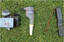  ??  ?? On the right, a stand alone soil moisture sensor, which can be connected to any automatic controller. On the left, an inexpensiv­e controller and moisture sensor package.