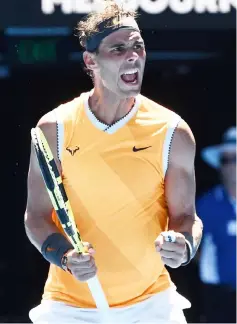  ??  ?? Nadal celebrates his victory against Duckworth during their men’s singles match on day one of the Australian Open tennis tournament in Melbourne. — AFP photo