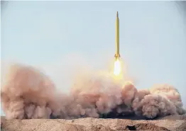  ?? IRANIAN REVOLUTION­ARY GUARD/SEPAHNEWS ?? A missile is launched in a drill Saturday in Iran. The Iranian Guard launched ballistic missiles at a simulated target in the Indian Ocean.