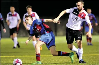  ?? Picture: Larry McQuillan ?? Thomas Byrne clashes with Drogheda Town’s Sam Reilly during last Wednesday’s friendly match at DIFE.