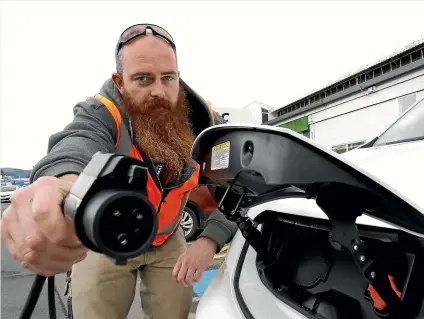  ?? MARTIN DE RUYTER/STUFF ?? Nelmac’s Cam Martin with Nissan E-NV200 plug in electric van which is part of the Nelmac vehicle fleet.