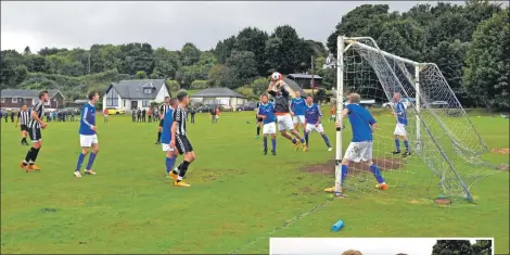  ?? 01_B35footy03 ?? Goalkeeper Gregor Adamson leaps into the air to claim ownership of the ball.