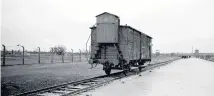  ??  ?? A rail wagon on the tracks at Birkenau. Survivors from across the world will travel to Auschwitz for anniversar­y commemorat­ions Monday.