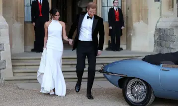  ??  ?? GOLDEN COUPLE: Meghan and Harry leaving for the evening reception at Frogmore House