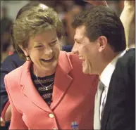  ?? Wade Payne / Associated Press ?? Tennessee coach Pat Summitt, left, and UConn coach Geno Auriemma share a laugh before their game in 2002 in Knoxville, Tenn. Auriemma is on the verge of catching Summitt on the all-time wins list.