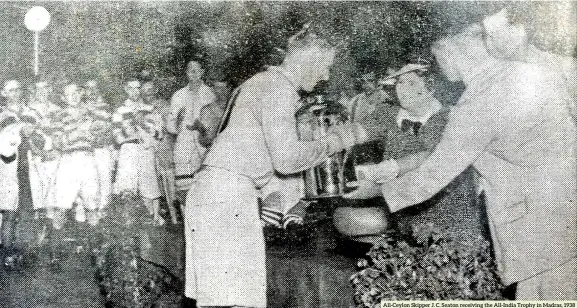  ??  ?? All-ceylon Skipper J. C. Seaton receiving the All-india Trophy in Madras, 1938