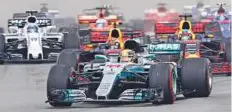  ?? Reuters ?? Mercedes’ Lewis Hamilton leads the pack at the start of the race in Sepang.