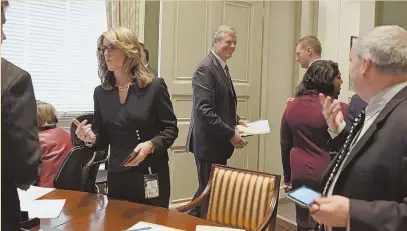  ?? STAFF FILE PHOTO BY FAITH NINIVAGGI ?? ‘AN APPEARANCE ISSUE’: Gov. Charlie Baker, seen at a Governor’s Council meeting last year, says he’d prefer council members not to proclaim that status when advertisin­g for clients.