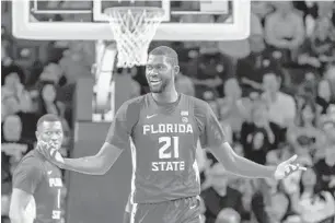  ?? DANNY KARNIK/AP ?? Christ Koumadje had reason to be smiling Saturday as his double-double helped Florida State win.