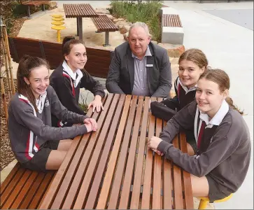  ?? Picture: PAUL CARRACHER ?? SHINY AND NEW: St Brigid’s College Horsham principal Gerard Raven and students, from left, Jaida Doran, Lily Jones, Madison Bethune and Chelsea Ellis use a new outdoor hub at the school.