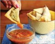  ?? PHOTO COURTESY OF THE PERFECT PANTRY ?? Serve baked samosa wontons with mango chutney.