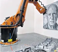  ??  ?? Work in progress: the Dark Factory giant robotic arm creates a portrait of Picasso
