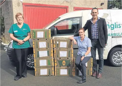  ??  ?? Audrey Kelly, left, pharmacist Debbie Miller and CEO Adam Tjolle of Inglis Vets Hospital.