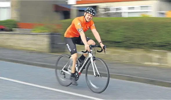  ??  ?? Gav McGrath in training near his home in Downfield for a nine-day fundraisin­g cycle the length of the UK.