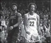  ?? Associated Press ?? HIGHS AND LOWS Arizona forward Zeke Nnaji (22) reacts after dunking next to USC guard Daniel Utomi during the second half of a game Thursday in Tucson, Arizona.