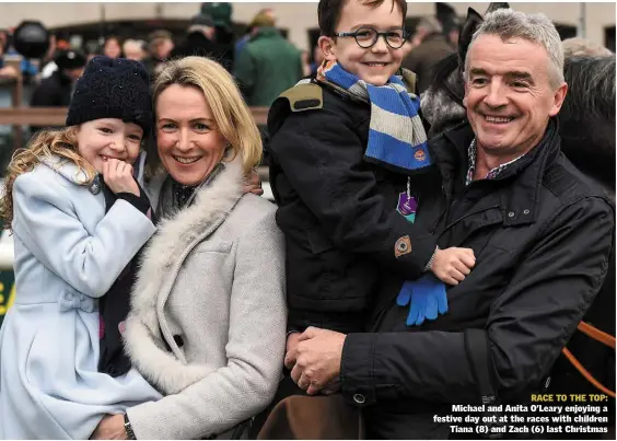  ??  ?? RACE TO THE TOP: Michael and Anita O’Leary enjoying a festive day out at the races with children Tiana (8) and Zach (6) last Christmas