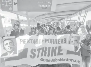  ??  ?? Workers at the Pentagon’s shops and restaurant­s protested in January for higher wages and better benefits. — WP-Bloomberg photo
