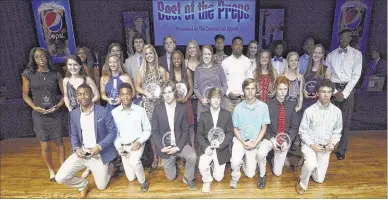  ?? PHOTOS BY CHRIS DESMOND SPECIAL TO THE COMMERCIAL APPEAL ?? Award winners at The Commercial Appeal’s Pepsi Best of the Preps 47th annual awards show pose for a group photo Friday night.