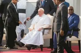  ?? GREGORIO BORGIA/AP ?? Pope Francis sits next to Congolese President Felix Tshisekedi on Tuesday in Kinshasa, Congo. The pontiff’s six-day tour of Africa will include a stop in South Sudan.