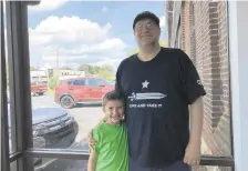  ??  ?? Daryl Mulvaney of Bethlehem Township shown with his 7-year-old son, Connor, is a Democrat who thinks insurance companies wield too much power.