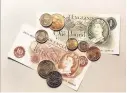  ??  ?? > Old money: The former pounds, shillings and pence were axed