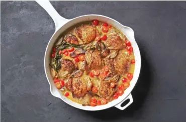  ?? CHRISTOPHE­R TESTANI/THE NEW YORK TIMES ?? Rishia Zimmern's chicken with shallots. Food stylist: Maggie Ruggiero. Prop stylist: Carla Gonzalez-Hart.
broken into small clusters on the vine
4 to 5 thyme sprigs, plus 2 teaspoons finely chopped thyme
Flaky sea salt, for serving