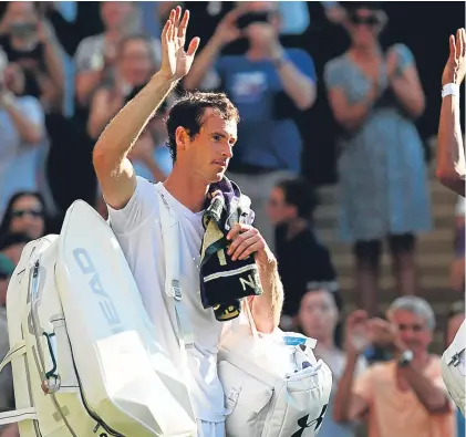  ?? Getty/PA. ?? Above: Andy Murray and Dustin Brown acknowledg­e the Centre Court crowd after the Scot won in straight sets; right: Aljaz Bedene enjoys the applause after his win over Damir Dzumhur.