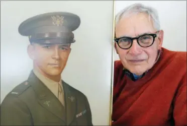  ?? NICK LISI — THE ASSOCIATED PRESS ?? Frank Fazekas Jr., right, poses for a photograph with a portrait of his father, Lt. Frank Fazekas, at his home in New Hartford, N.Y., on Saturday. Fazekas never knew his father. He was just 6months old at the time of the crash of the pilot’s fighter...