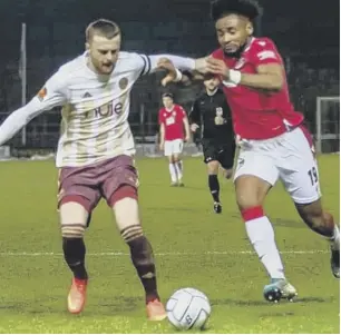  ??  ?? MATCH ACTION: from Town’s 0-0 draw at Wrexham on Tuesday. Photos by Declan Lloyd.