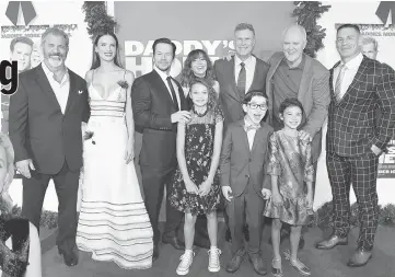  ?? — AFP photo ?? (Left-Right Back Row) Mel Gibson,Alessandra Ambrosio, Mark Wahlberg, Linda Cardelinni,Will Ferrell, John Lithgow, John Cena, (Left-Right Front Row) Didi Costine, Owen Wilder Vaccaro and Scarlett Esteves attendthe premiere of Paramount Pictures’...