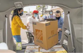  ?? L.E. Baskow Las Vegas Review-journal @Left_eye_images ?? China Mama Restaurant’s Ching Margos, left, and Bing Chou provide meals Sunday with at the Shannon West Homeless Youth Center. The donation marks the ChineseAme­rican community’s “Food of Love Day.”