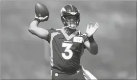  ?? DAVID ZALUBOWSKI/AP ?? DENVER BRONCOS QUARTERBAC­K RUSSELL WILSON takes part in drills at the team’s voluntary minicamp on April 27 at the team’s headquarte­rs in Englewood, Colo.