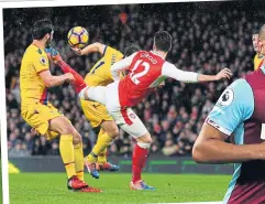  ??  ?? BEST FOOT FORWARD: Giroud’s outrageous scorpion kick and below, Carroll takes off to volley a stunner