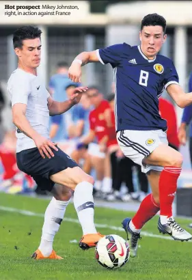  ??  ?? Hot prospect Mikey Johnston, right, in action against France