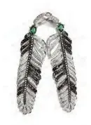  ??  ?? Dream Feather earrings in white and black diamonds and tsavorites