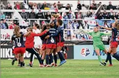  ?? Jeff Dean / Associated Press ?? Washington Spirit players celebrate after defeating Chicago Red Stars in the NWSL Championsh­ip 2-1 on Saturday.