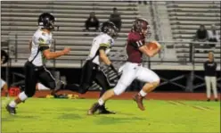  ?? AUSTIN HERTZOG - DIGITAL FIRST MEDIA ?? Pottsgrove quarterbac­k Jay Sisko outruns the defense for a 49-yard touchdown run Friday against Interboro.