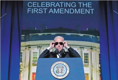  ?? CAROLYN KASTER/AP PHOTO ?? President Joe Biden puts on sunglasses after making a joke about becoming the “Dark Brandon” persona during the White House Correspond­ents’ Associatio­n dinner at the Washington Hilton in Washington on Saturday, April 29.