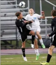  ?? KIRK NEIDERMYER - FOR DIGITAL FIRST MEDIA ?? Daniel Boone’s Carter Ferguson (20) goes up for the header against Manheim Central’s Maverick King (10) at Cedar Crest High School in South Lebanon on Thursday, October 27.