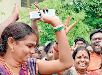  ??  ?? The street dance of victory: Hundreds of Jayalalith­aa devotees do the Tamil Nadu Natyam as news breaks of their Amma's miracle release from jail. AFP