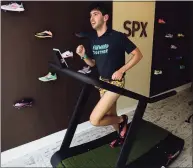  ?? Erik Trautmann / Hearst Connecticu­t Media ?? Jeremy Garskof tries out a pair of shoes on the Trueform treadmill at the pop-up shop for cross country runners, SPX, on Saturday.