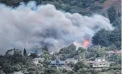  ?? PHOTO: BRUCE CALDER ?? Smoke and flames from the house fire in Beaconsfie­ld Rd, in Portobello, on Saturday were seen from Port Chalmers.