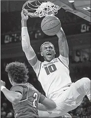  ?? NWA Democrat-Gazette/BEN GOFF ?? Daniel Gafford dunks during the first half of Arkansas’ 78-77 loss to Western Kentucky on Saturday at Walton Arena in Fayettevil­le.