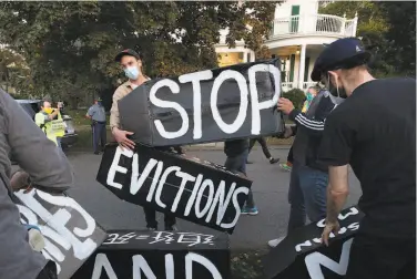  ?? Michael Dwyer / Associated Press 2020 ?? Housing activists protested evictions last year in Swampscott, Mass. A federal judge ruled this week the CDC exceeded its authority when it imposed a federal eviction moratorium due to the pandemic.