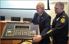  ?? PETE BANNAN - MEDIANEWS GROUP ?? Haverford police Chief John Viola was presented with a framed plaque of his service badges. To his right is Deputy Joe Hagan.