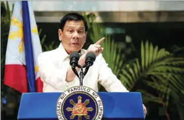  ?? NOEL CELIS/AFP ?? Philippine President Rodrigo Duterte answers questions from the press at Manila Internatio­nal Airport yesterday.