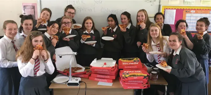  ??  ?? Transition year students form Loreto Secondary School enjoying the pizza party the won after they volunteere­d for the Special Olympics national collection day 2017.